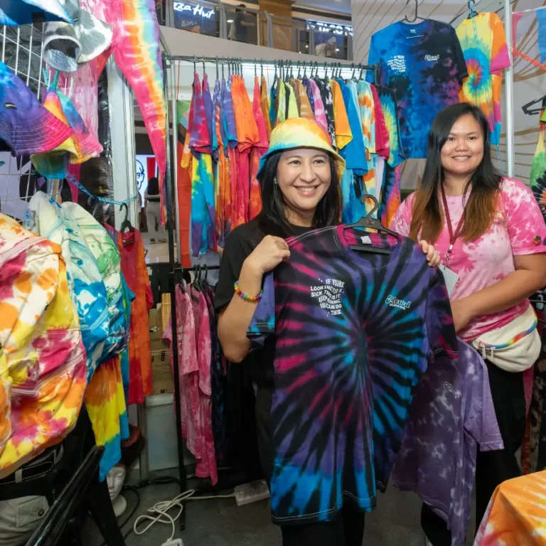 Joy Belmonte, Mayor of Quezon City, holding a tie-dye shirt in support of an LGBTQIA+-owned business